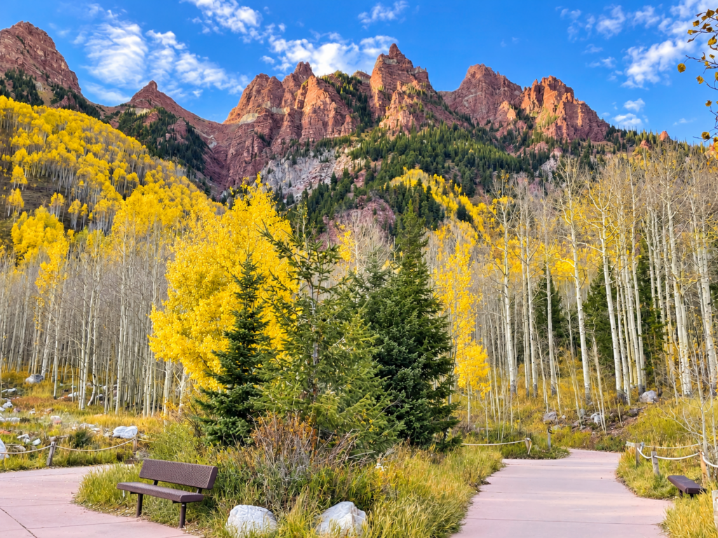 Autumn aspens and rugged red-rock mountains looking towards Maroon Bells amphitheater